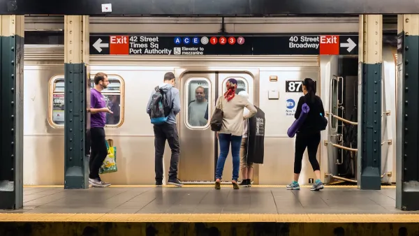MTA subway train station platform with people traveling in New York on June 28, 2013.