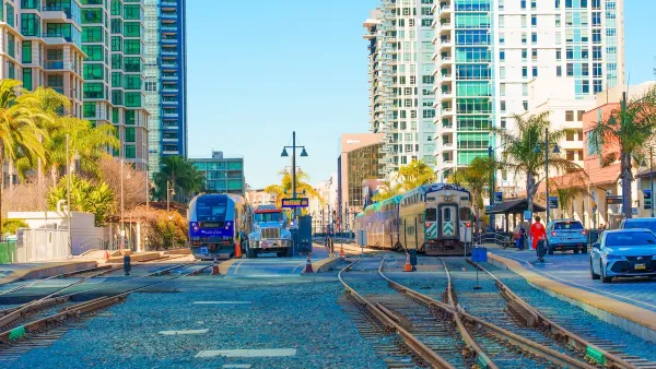 Train station in San Diego, California surrounded by tall buildings.