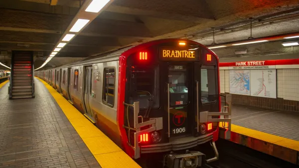 Boton Red Line subway train with Braintree on front marquee in station.