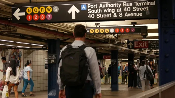 People navigate an underground subway system in New York City.