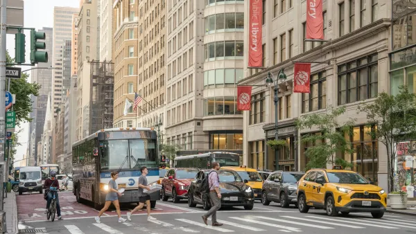 Pedestrians crossing New York City crossalk in front of bus and cars.