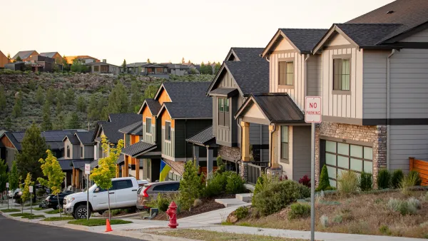 Two-story homes with driveways on small street in Bend, Oregon.
