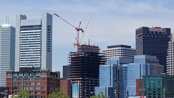 Buildings in downtown Boston with large red construction crane.