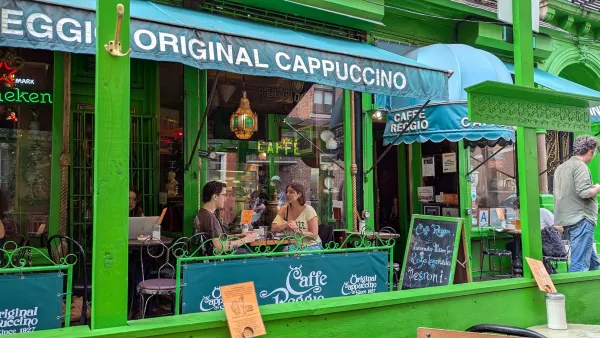 Bright green restaurant patio with diners in SoHo, New York City.