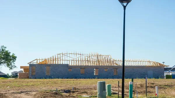 Half-built wood frame home.