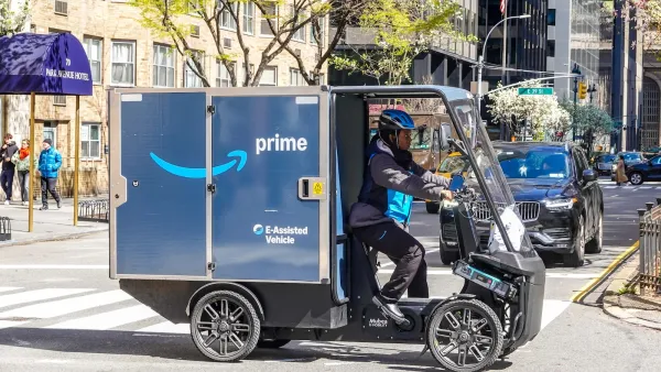 A blue Amazon three-wheeled electric delivery cargo bike in New York City.
