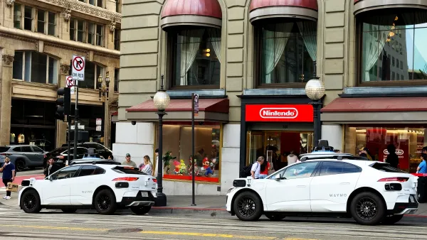 Two Waymo robotaxis parked in San Francisco