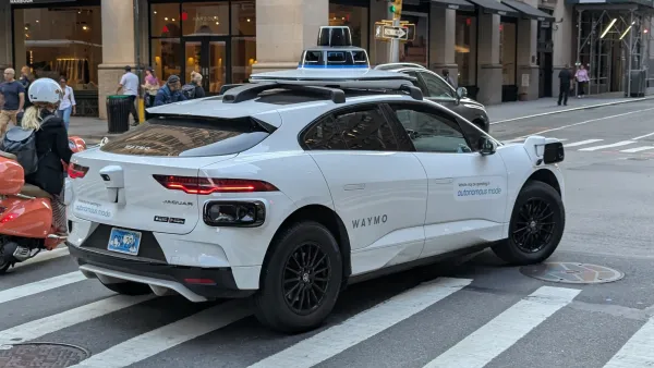 White Waymo self-driving taaxi in New York City.
