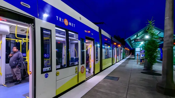TriMet train at a platform at nighttime.