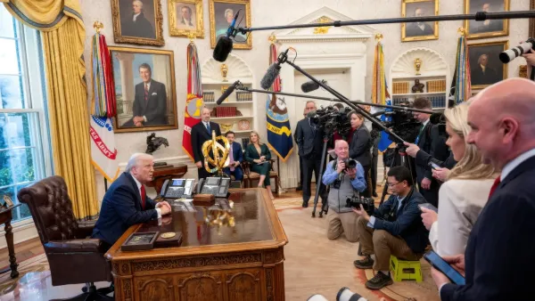 President Donald Trump sitting at desk in Oval Office during presser announcing tariffs. 