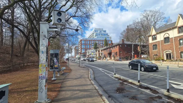 White traffic enforcement camera on roadside in Toronto, Canada.