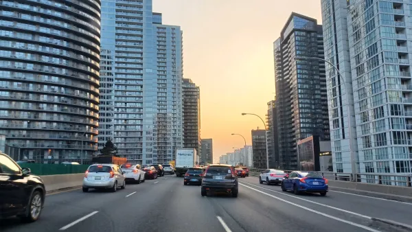 An elevated highway in Toronto surrounded by tall apartment buildings