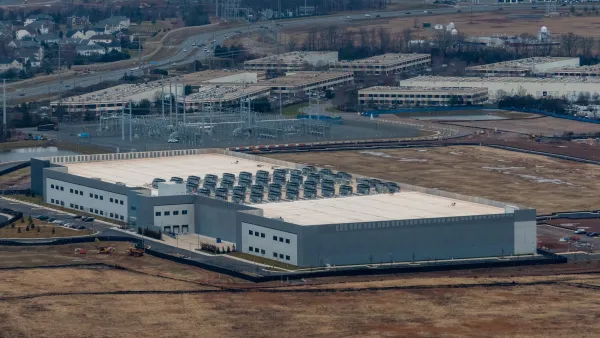 A data center next to homes and vacant land in Dulles, Virginia.
