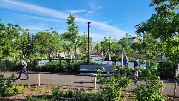 Playground at the Obama Center in Chicago visible behind fence.