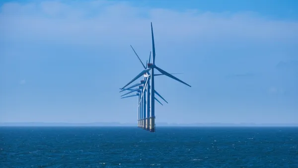 A line of offshore windmills.
