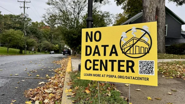 A yellow sign on the side of the road reads "NO DATA CENTER"
