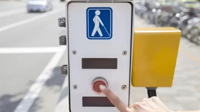 Crosswalk button with illustration of visually impaired pedestrian