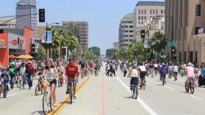 Many people on bikes riding on city street during CicLAvia event in Pasadena, California