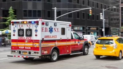 Ambulance driving down New York City street