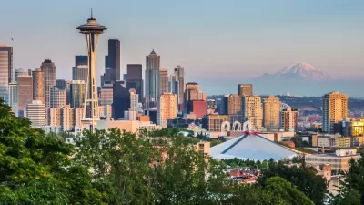 Seattle skyline panorama seen from Kerry Park at sunset in golden evening light with Mount Rainier in the background, Washington State, United States of America