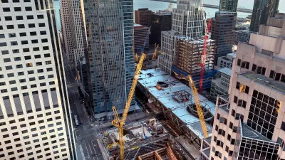 View looking down on construction of multiple buildings in San Francisco's Transbay Transit Center District