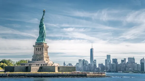 View of Statue of Liberty with New York City skyline in background