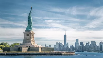 View of Statue of Liberty with New York City skyline in background