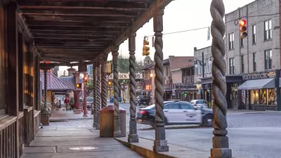 View down covered sidewalk in historic Stockyards district in Fort Worth, Texas