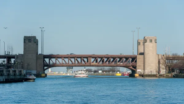 The Lake Shore Drive Bridge with a boat passing under it.