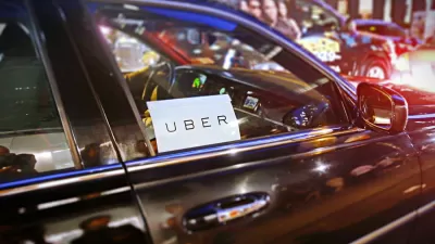 Close-up of car windshield with Uber sticker on city street