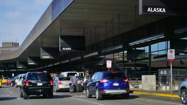 Cars pulling in at SeaTac airport drop-off area.