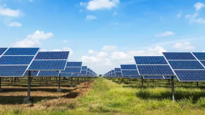 Solar panels in a green field