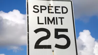 25mph speed limit sign against blue sky with white clouds