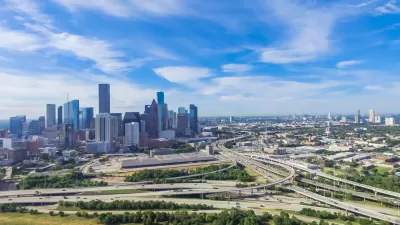 Aerial view of freeways and downtown Houston skyline