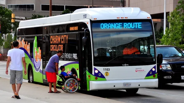 People boarding a bus on Maryland's Orange Route.