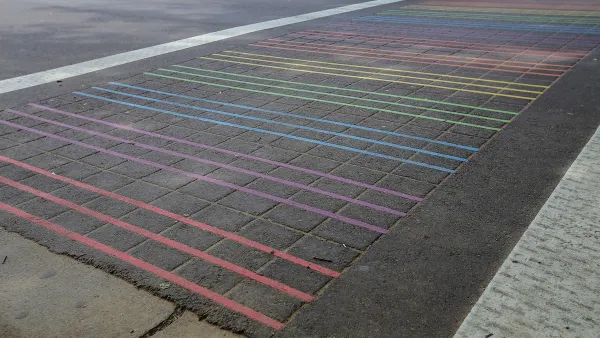 Rainbow striped crosswalk with thin stripes on asphalt in Sacramento, California