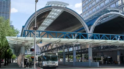 Downtown Houston covered bus station with one parked bus