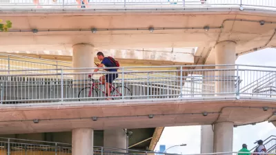 Bike rider on multi-tiered Philadelphia bridge