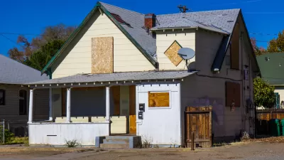 Boarded up, vacant house