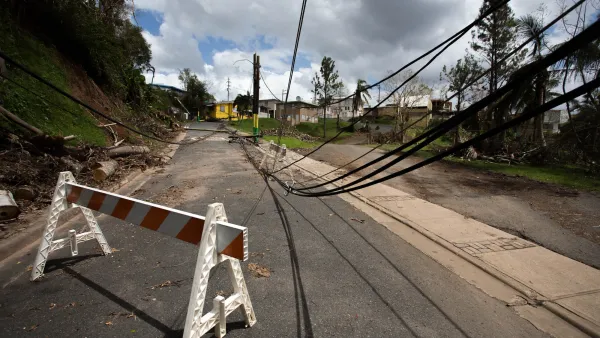 Downed power lines in road in Puerto Rico after a hurricane.