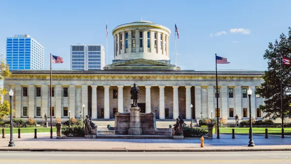 View of Ohio Statehouse with statue 