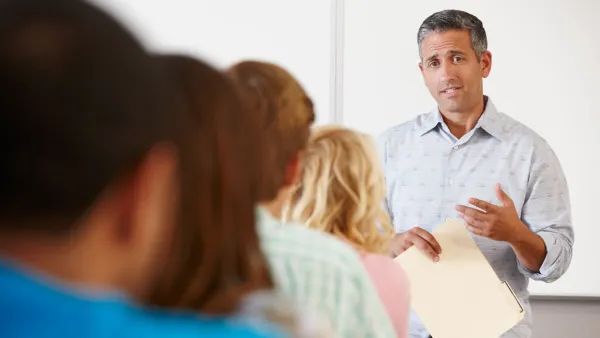 Tutor with class of students 