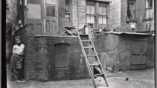 Rear of tenements with young boy: Manhattan