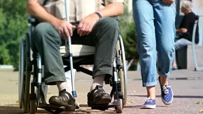 Wheelchair user on sidewalk