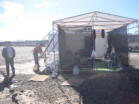 Jim Nicholson stands by his friend Ron Jones and his compact campsite.